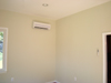 Notice interior part of heat pump on left wall and remote control thermostat on right wall.  This heat pump is designed for single room use and is extremely efficient. 