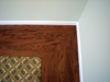 Close up of wool carpet and wood border.