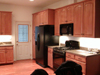 Exhaust for microwave hood runs above cabinets, into the attic, and through the roof. <br />Waiting for tile backsplash.